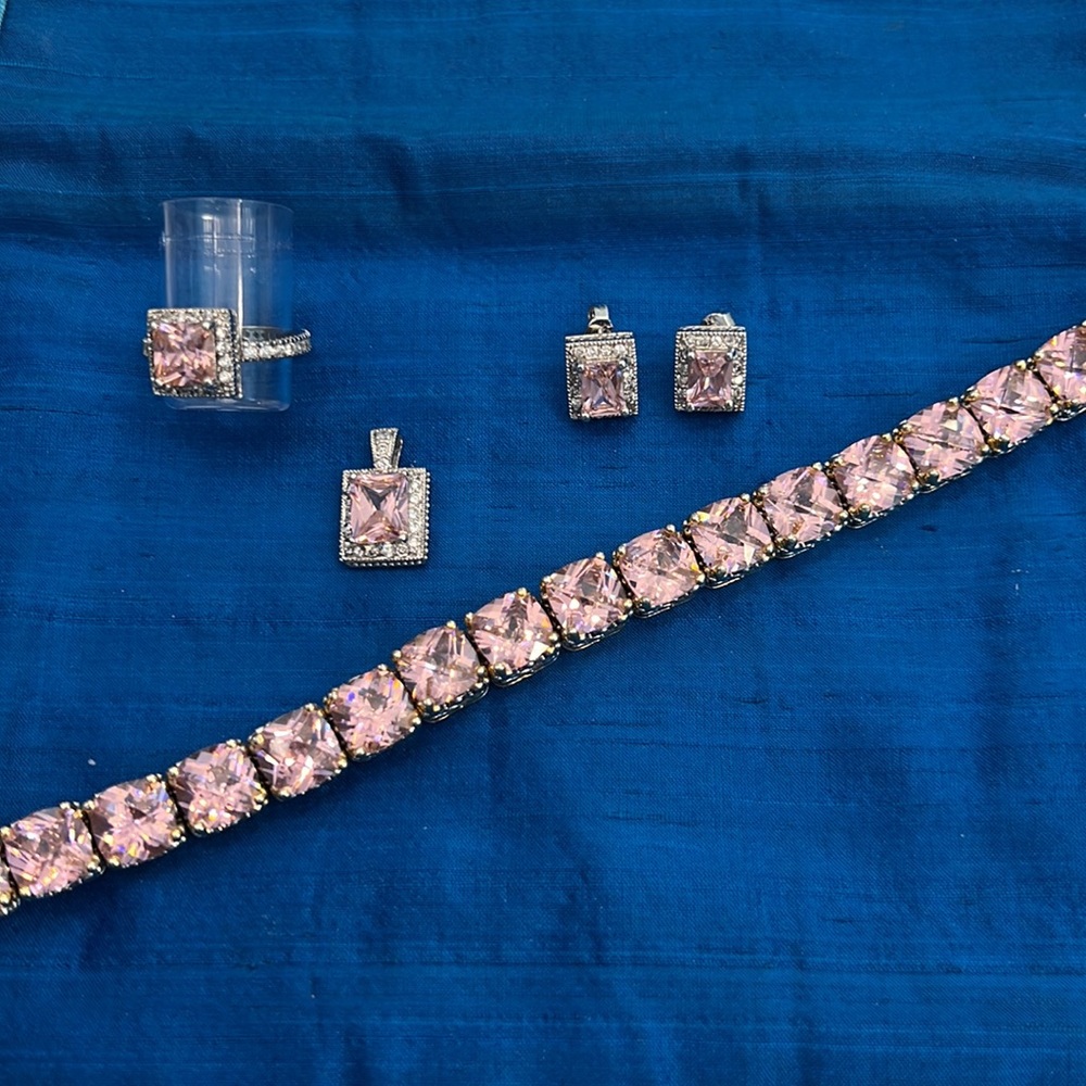 Pink rhinestone bracelet with matching pendant, earrings and pendant. Costume